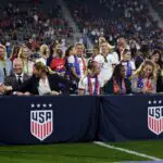 U.S. Soccer Federation CEO Will Wilson, U.S. Soccer Federation president Cindy Parlow Cone and Becky Sauerbrunn, Crystal Dunn, Sam Mewis of the USWNT talk during the signing of the collective bargaining agreement after a game between Nigeria and USWNT at Audi Field on September 6, 2022 in Washington, DC.