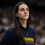 Caitlin Clark #22 of the Indiana Fever looks on during the third quarter of the championship game of the 2025 Commissioners Cup against the Minnesota Lynx at Target Center on July 1, 2025 in Minneapolis, Minnesota.