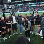 Morgan Weaver #22 of Portland Thorns FC talks to the team in a huddle after the NWSL match between Portland Thorns and Houston Dash at Providence Park