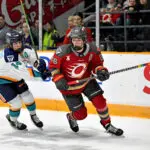 Emily Clark #26 of the Ottawa Charge skates against Jaime Bourbonnais #14 of the New York Sirens.