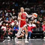 Chennedy Carter #23 of the Las Vegas Aces dribbles the ball during the game against the Atlanta Dream.