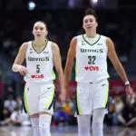 Paige Bueckers #5 and Jessica Shepard #32 of the Dallas Wings look on during the game against the Toronto Tempo.