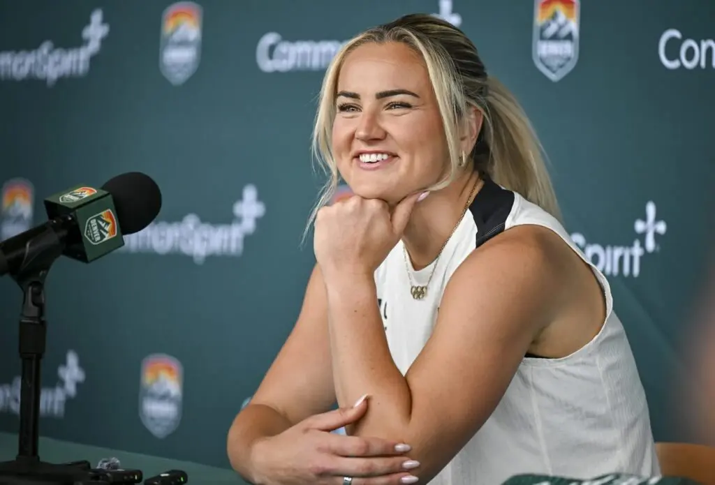 Lindsey Heaps smiles during a press conference for Denver Summit FC.