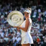 Linda Noskova of Czechia poses for a photo with the Venus Rosewater Dish after victory against Karolina Muchova of Czechia in their Ladies' Singles final match on day thirteen of The Championships Wimbledon