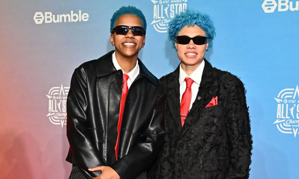 Natisha Hiedeman and Courtney Williams pose on the 2026 WNBA All Star orange carpet.