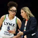 Head coach Cheryl Reeve talks to Olivia Miles #5 of the Minnesota Lynx in the fourth quarter against the New York Liberty at Target Center on July 11, 2026 in Minneapolis, Minnesota. The Lynx defeated the Liberty 90-85.