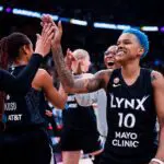 Courtney Williams #10 of the Minnesota Lynx celebrates with teammates after defeating the Toronto Tempo at Scotiabank Arena on July 30, 2026 in Toronto, Canada