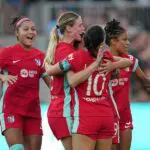 Haley Hopkins #13 of Kansas City Current celebrates scoring her team's fourth goal during the NWSL match between Kansas City Current and Racing Louisville FC