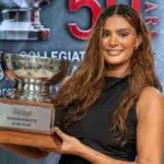 Lauren Betts, a senior basketball player from UCLA, holds 2026 Collegiate Woman Athlete of the Year Honda Cup trophy.