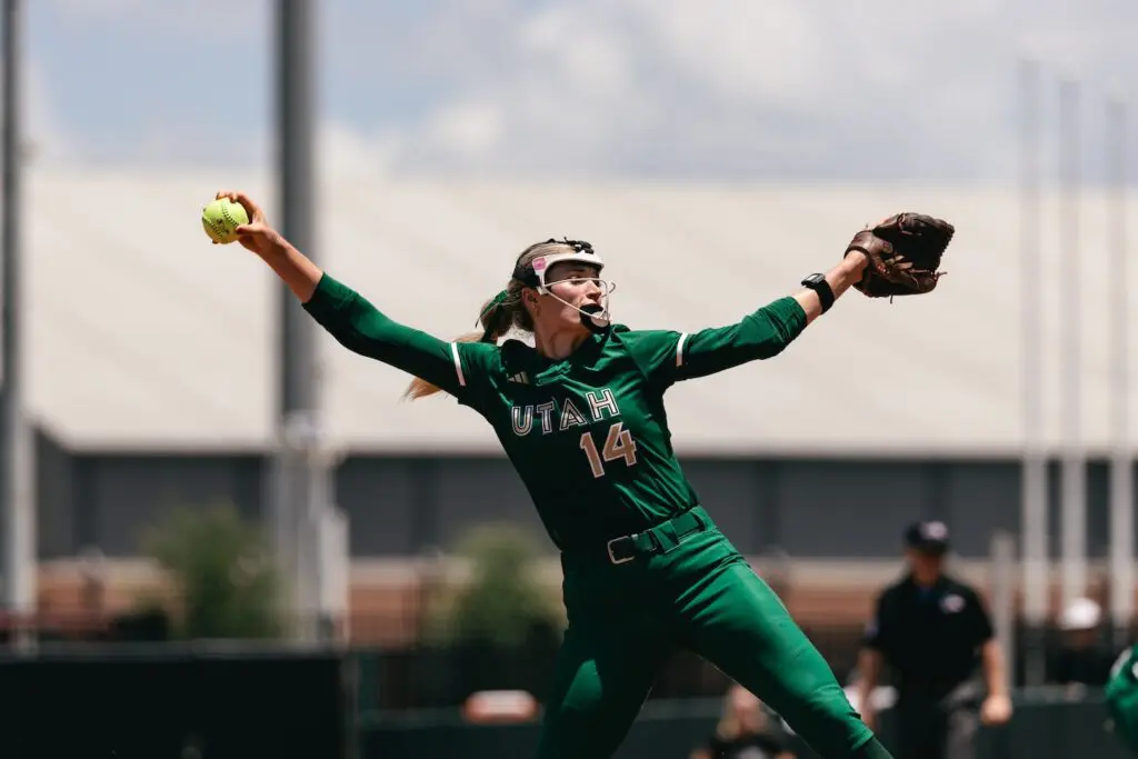 Montana Fouts in her pitching motion while competing in a green Utah Talons jersey.