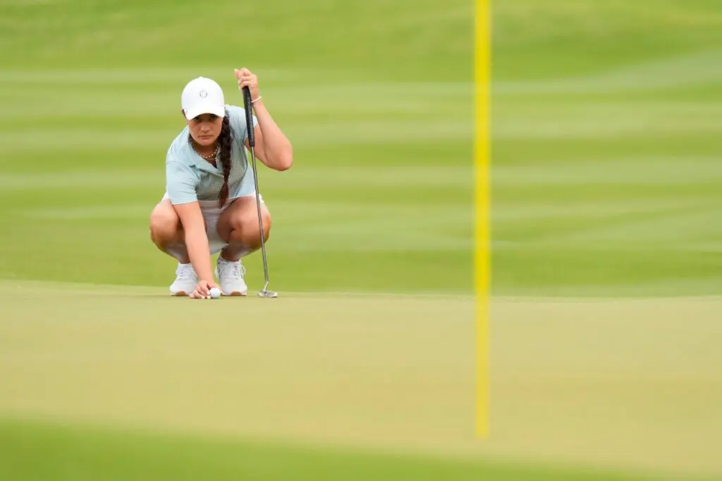 Kiara Romero, of Calif., lines up a putt on No. nine green during the second round of the Augusta National Women's Amateur at Champions Retreat.