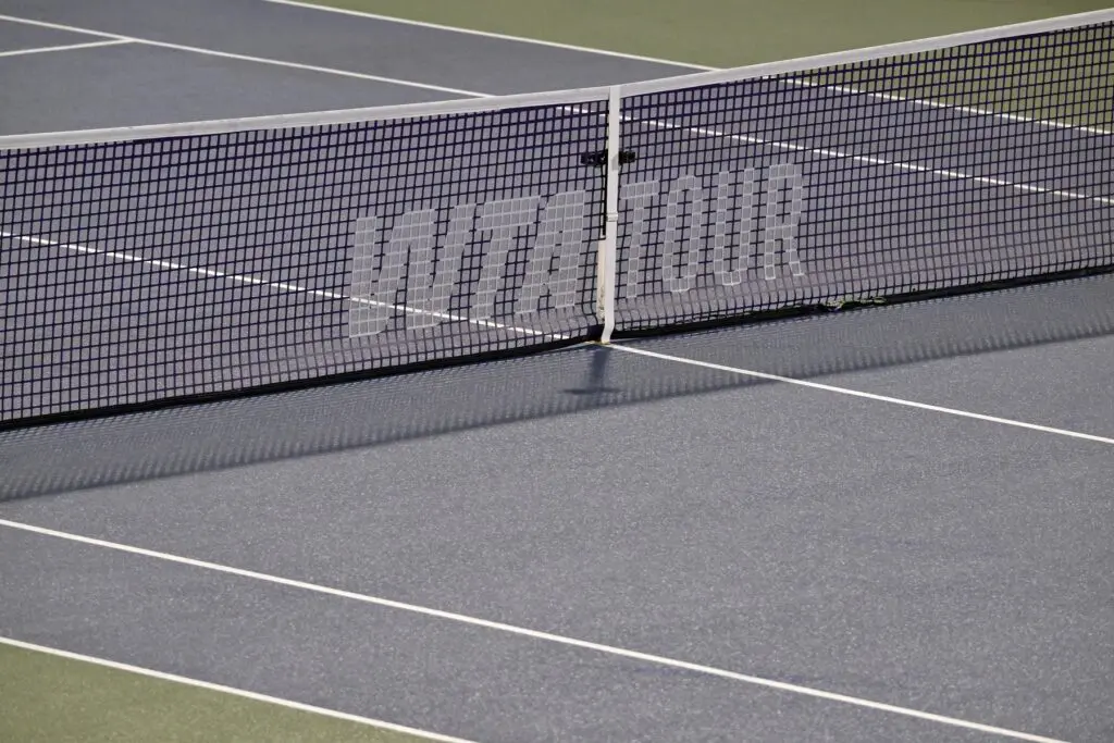Rain delay on centre court and the WTA logo on the net during the match between Jessica Bouzas Maneiro (ESP) and Lin Zhu (CHN) in fourth round play at IGA Stadium.