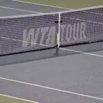 Rain delay on centre court and the WTA logo on the net during the match between Jessica Bouzas Maneiro (ESP) and Lin Zhu (CHN) in fourth round play at IGA Stadium.