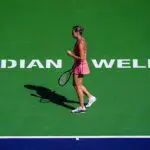 Aryna Sabalenka reacts to winning the second game against Elena Rybakina to tie 1-1 in the first set of the women’s singles championship final at the BNP Paribas Open in Indian Wells.