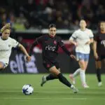 Portland Thorns FC forward Sophia Wilson (9) chases down a lose ball during the second half against Seattle Reign FC forward Brittany Ratcliffe (13) at Providence Park.