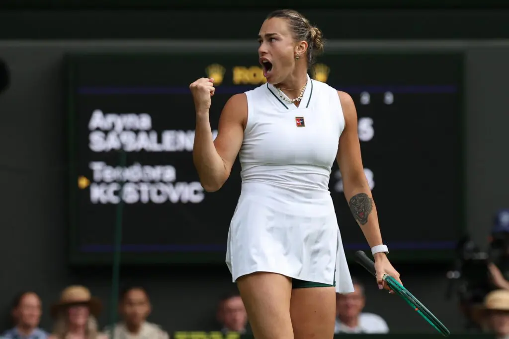 Aryna Sabalenka celebrates after match point against Teodora Kostovic at Wimbledon.