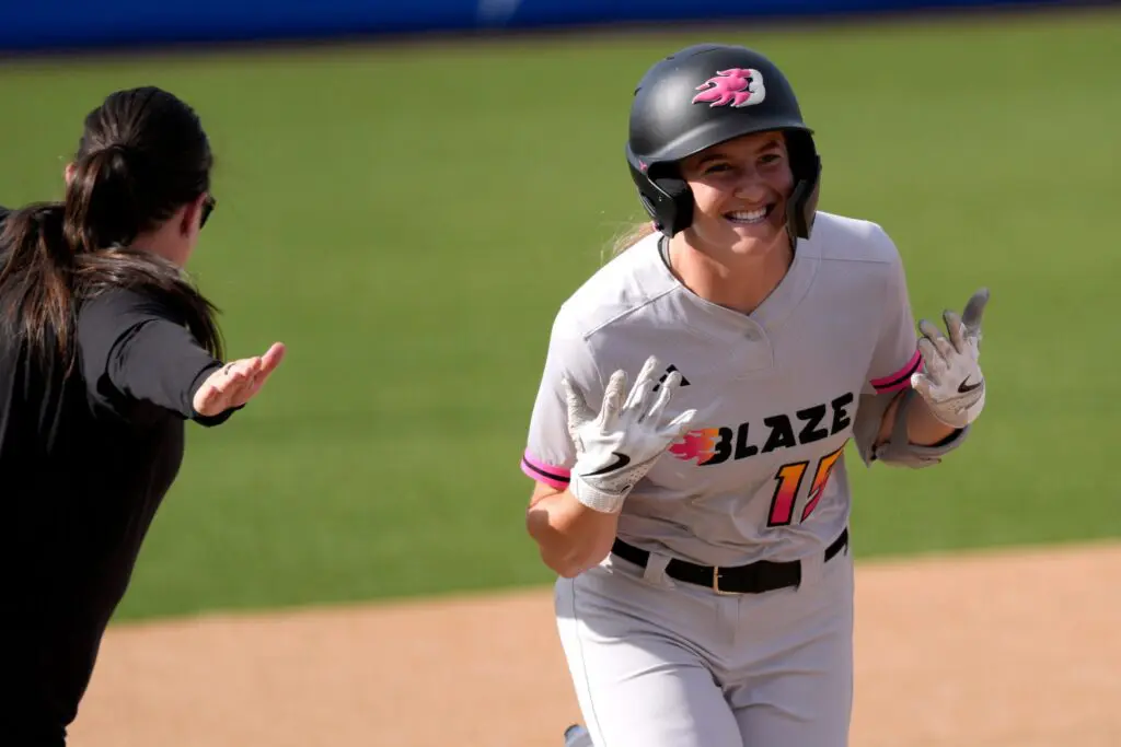 Reese Atwood of the Blaze celebrates after hitting a home run during an AUSL softball game between the Oklahoma City Spark and the Carolina Blaze at Oklahoma Christian University.