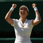 Alexandra Eala of the Philippinesr celebrates winning her match against Iga Swiatek of Poland on day six at All England Lawn Tennis and Croquet Club.