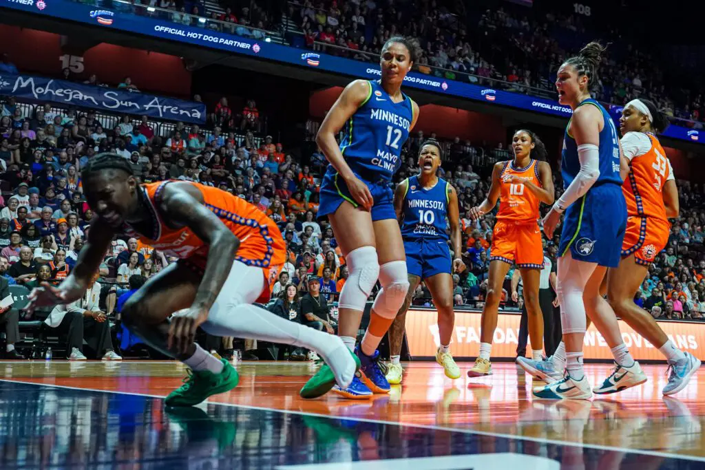 Connecticut Sun guard Saniya Rivers (22) is injured on s play against Minnesota Lynx forward Nia Coffey (12) in the first half at Mohegan Sun Arena.