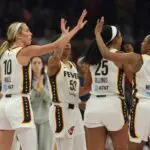 Indiana Fever guard Lexie Hull (10) celebrates with teammate Kelsey Mitchell (0) against the Phoenix Mercury in the first half at Mortgage Matchup Center.