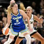 Dallas Wings guard Paige Bueckers (5) looks to move the ball past Chicago Sky guard Jacy Sheldon (0) during the second half at the American Airlines Center.