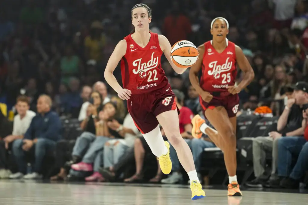 Indiana Fever guard Caitlin Clark (22) dribbles the ball during the first quarter of a WNBA basketball game against the Las Vegas Aces at Michelob Ultra Arena.