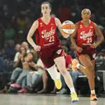 Indiana Fever guard Caitlin Clark (22) dribbles the ball during the first quarter of a WNBA basketball game against the Las Vegas Aces at Michelob Ultra Arena.