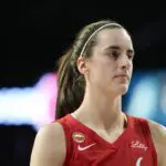 Indiana Fever guard Caitlin Clark (22) looks on during the third quarter of a WNBA basketball game against the Las Vegas Aces at Michelob Ultra Arena.