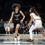 Jul 13, 2026; Minneapolis, Minnesota, USA; Minnesota Lynx guard Olivia Miles (5) dribbles the ball as Phoenix Mercury guard Monique Akoa Makani (8) plays defense in the first half at Target Center.