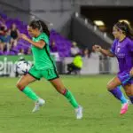Boston Legacy FC midfielder Barbara Olivieri (21) moves the ball in front of Orlando Pride midfielder Angelina Alonso Costantino (7) during the second half at Inter&Co Stadium.