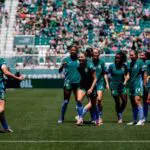 Denver Summit FC defender Janine Sonis (6) celebrates with midfielder Lindsey Heaps (10) and teammates after her goal in the first half against the Portland Thorns FC at Centennial Stadium.