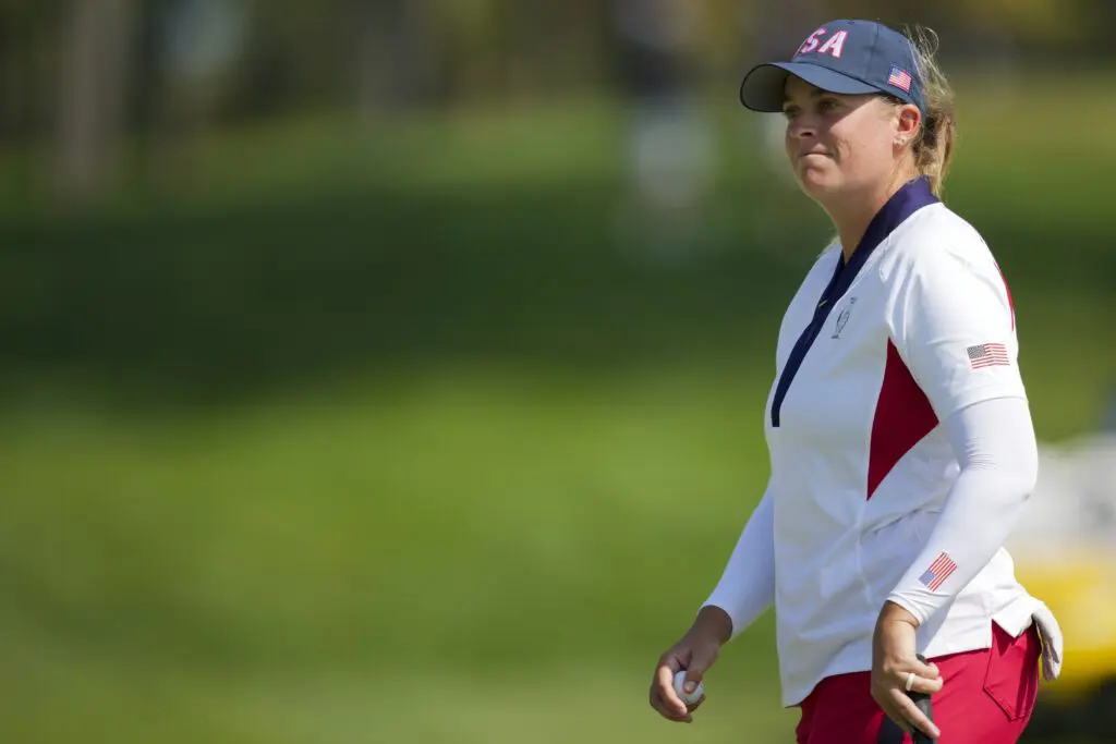 Lauren Coughlin of Team USA reacts to her putt on the 18th green during single matches against Team Europe during the Solheim Cup 2024 at Robert Trent Jones Golf Club.