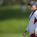 Lauren Coughlin of Team USA reacts to her putt on the 18th green during single matches against Team Europe during the Solheim Cup 2024 at Robert Trent Jones Golf Club.