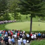 Fans gather at the 15th green to watch Brooke Henderson and Minjee Lee putt during the final round of the CPKC Women's Open golf tournament.