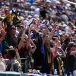 Denver Summit FC fans cheer during the match against the Washington Spirit at Empower Field at Mile High.