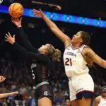 UConn Huskies forward Sarah Strong (21) defends against South Carolina Gamecocks guard Tessa Johnson (5) during the semifinal of the Final Four of the women's 2026 NCAA Tournament.