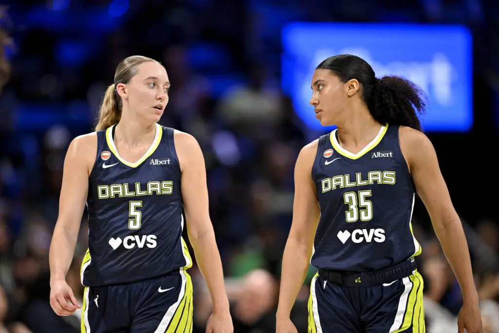 Dallas Wings guard Paige Bueckers (5) and guard Azzi Fudd (35) walk back on to the court during the first half against the Seattle Storm.