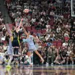 Dallas Wings guard Paige Bueckers (5) shoots a three pointer against the Toronto Tempo in the second half at the Bell Centre.