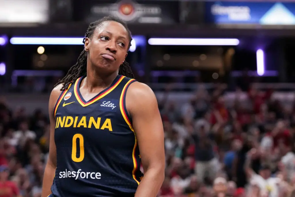 Indiana Fever guard Kelsey Mitchell (0) reacts after scoring Saturday, July 18, 2026, during the second half of a game at Gainbridge Fieldhouse in Indianapolis. The Indiana Fever defeated the New York Liberty, 108-88.