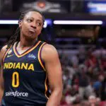 Indiana Fever guard Kelsey Mitchell (0) reacts after scoring Saturday, July 18, 2026, during the second half of a game at Gainbridge Fieldhouse in Indianapolis. The Indiana Fever defeated the New York Liberty, 108-88.