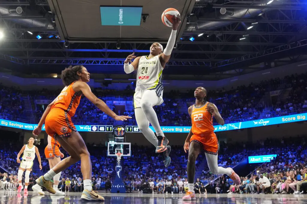 Dallas Wings guard Arike Ogunbowale (24) scores a basket against the Connecticut Sun during the second half at College Park Center.