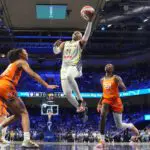 Dallas Wings guard Arike Ogunbowale (24) scores a basket against the Connecticut Sun during the second half at College Park Center.