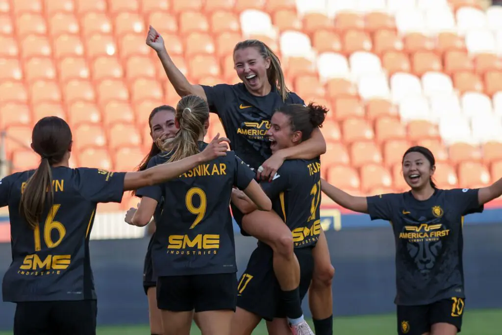 Utah Royals FC defender Kate del Fava (8) celebrates with teammates after scoring a goal against the Portland Thorns FC during the second half at America First Field.