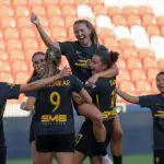 Utah Royals FC defender Kate del Fava (8) celebrates with teammates after scoring a goal against the Portland Thorns FC during the second half at America First Field.