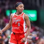 Las Vegas Aces guard Jackie Young (0) reacts after a basket against the Atlanta Dream in the third quarter at State Farm Arena.