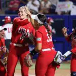 Team USA's Hannah Flippen, Montana Fouts, Alyssa Brito and Dejah Mulipola celebrate after the gold medal game between Japan and the US Womens National Team in the USA Softball International Cup at Devon Park in Oklahoma City.