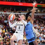 Indiana Fever guard Sophie Cunningham (8) drives to the basket against Chicago Sky guard DiJonai Carrington (7) during the first half at United Center.