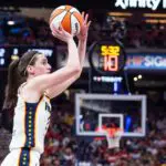 Indiana Fever guard Caitlin Clark (22) shoots the ball in the second half against the New York Liberty at Gainbridge Fieldhouse.