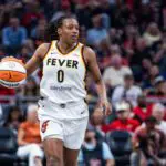 Indiana Fever guard Kelsey Mitchell (0) dribbles the ball in the second half against the New York Liberty at Gainbridge Fieldhouse.