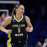 Dallas Wings guard Paige Bueckers (5) reacts after making her first basket of the game against the Toronto Tempo during the third quarter at College Park Center.